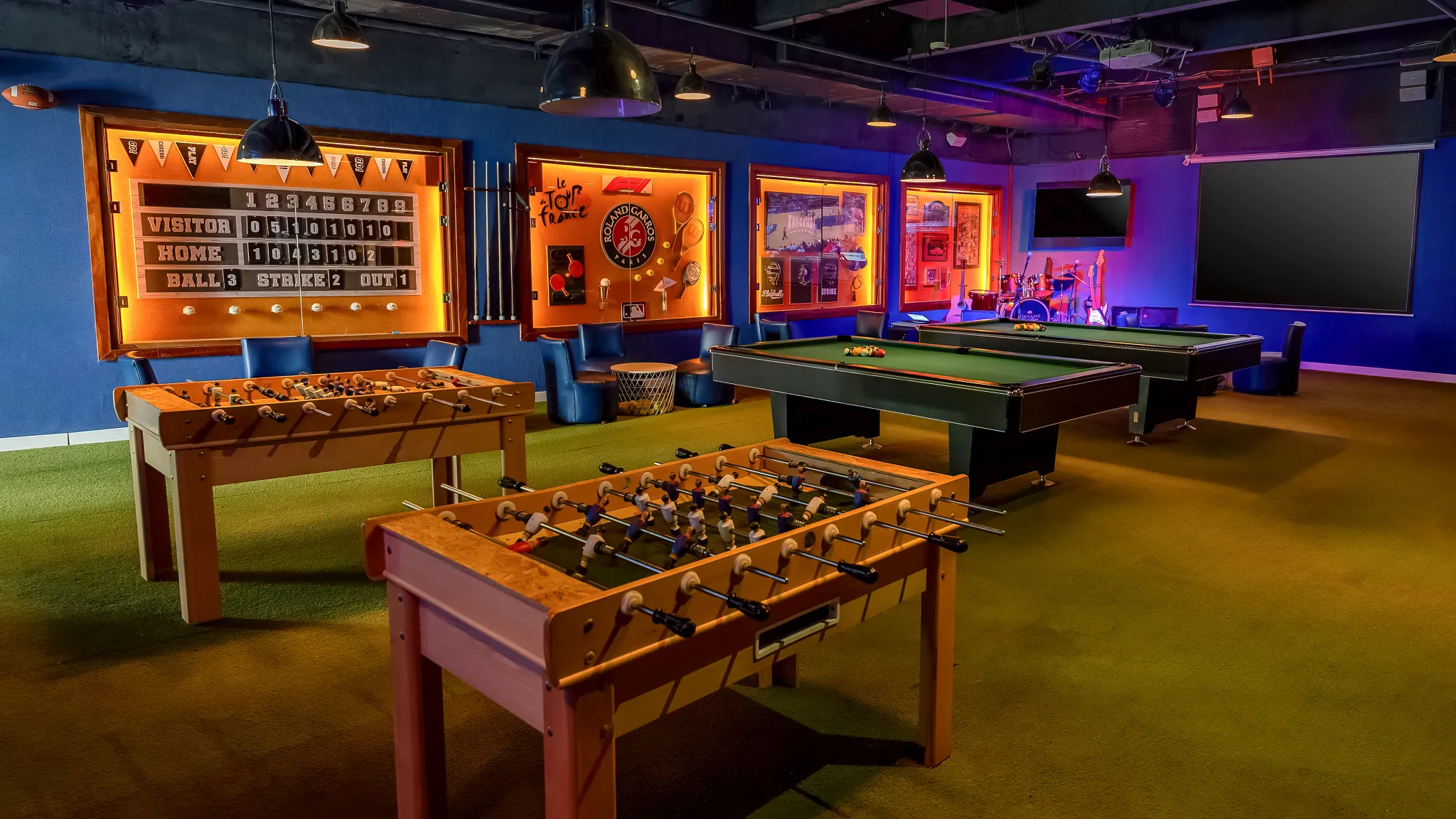 Halftime Bar sports bar at Dreams Royal Beach Punta Cana featuring multiple screens, casual seating, and a lively game-day atmosphere.