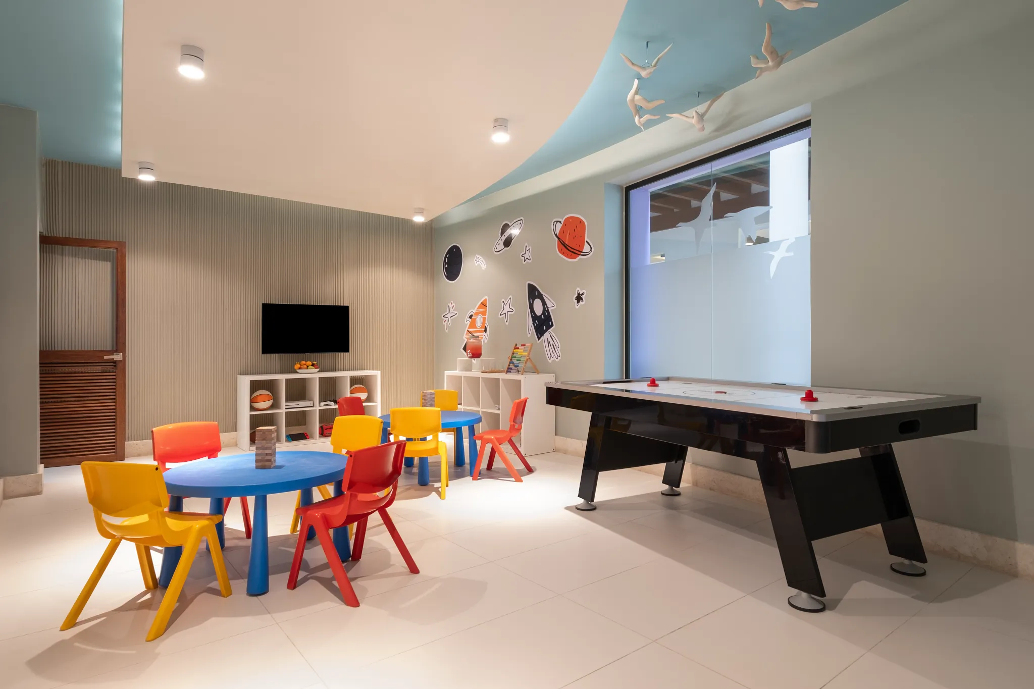 Indoor kids club with games, air hockey, and play tables at Dreams Royal Beach Punta Cana.