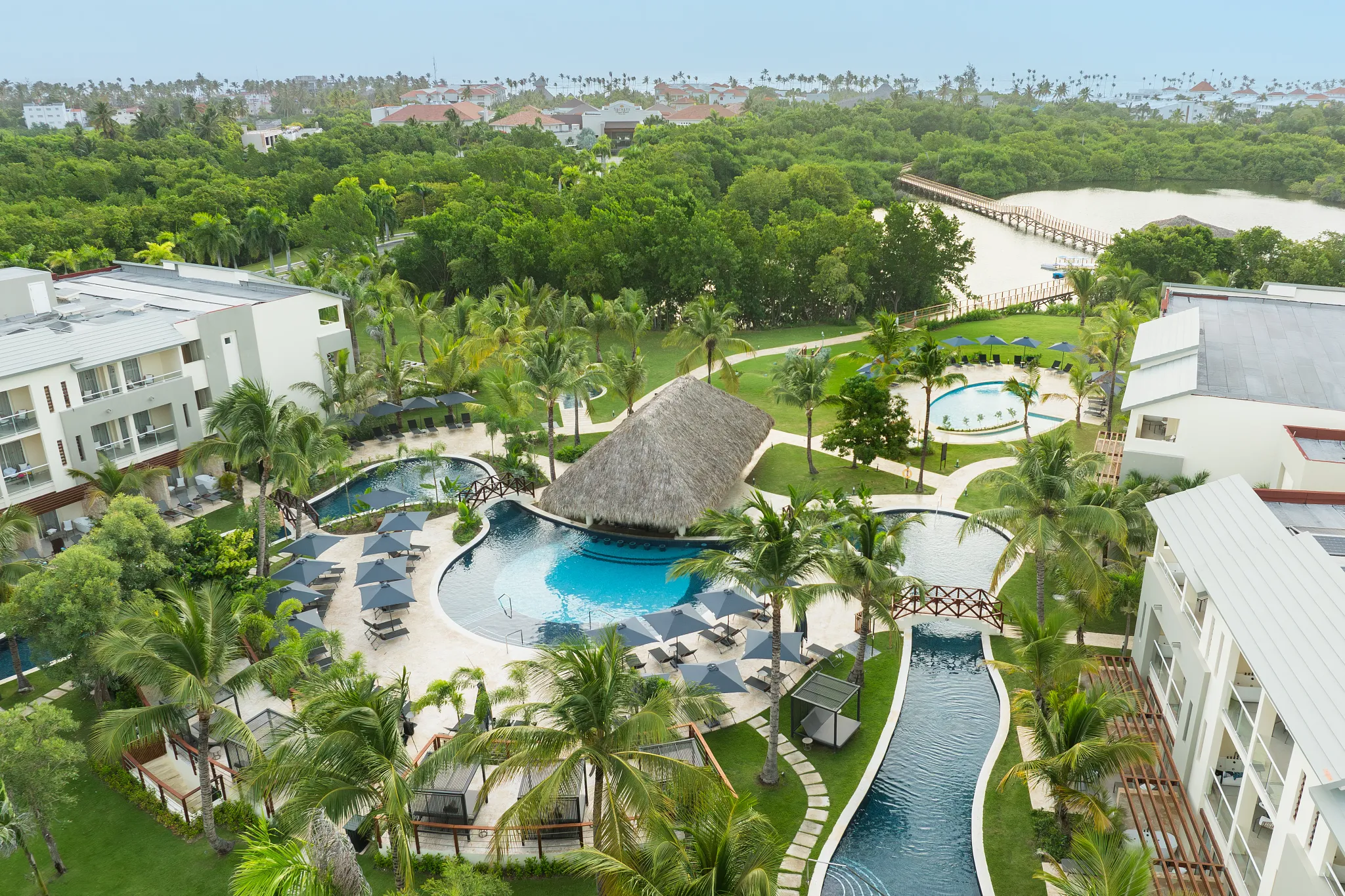 Aerial view of winding pools and tropical landscaping at Dreams Royal Beach Punta Cana resort.