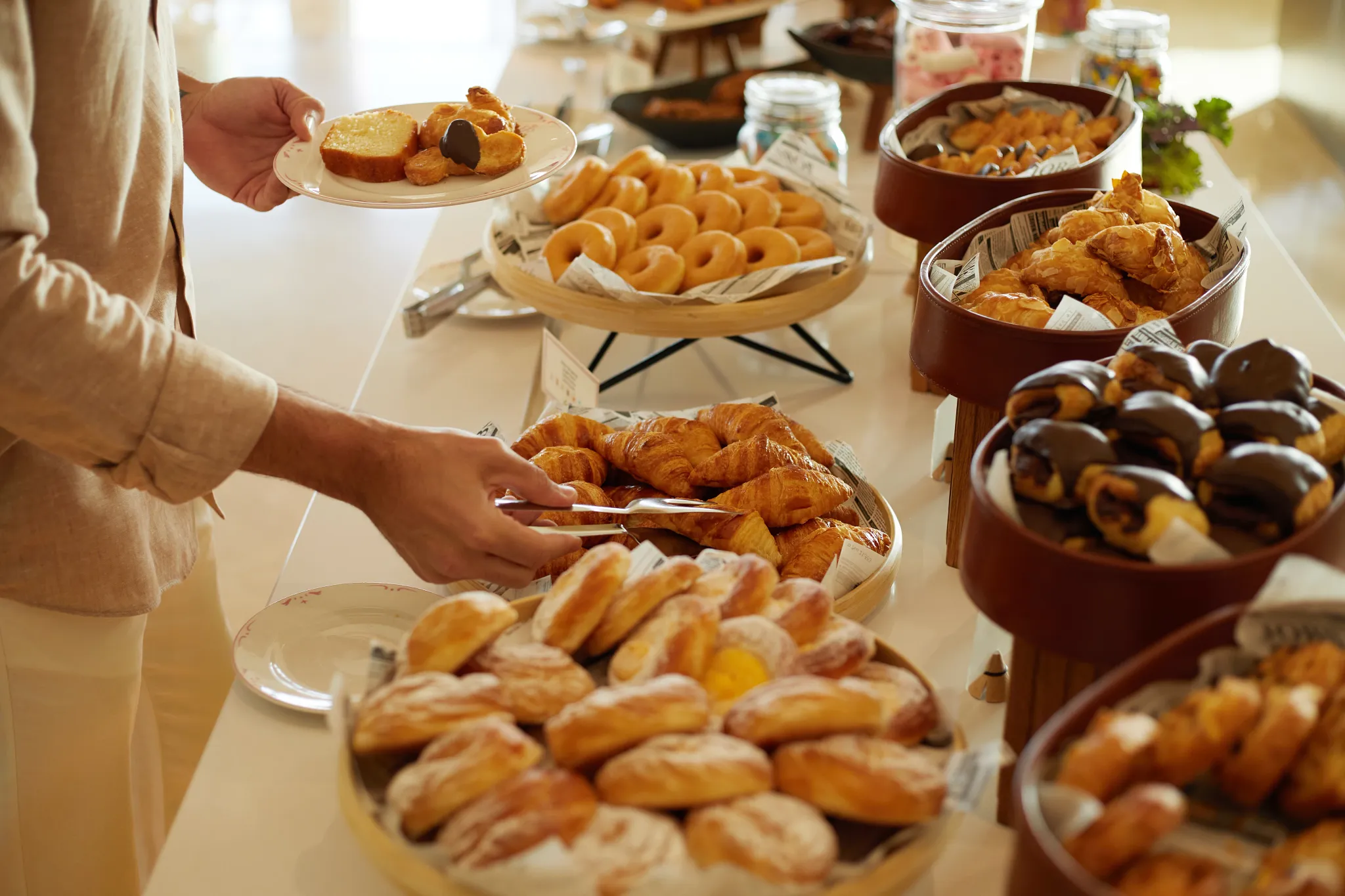 Market Cafe at Dreams Royal Beach Punta Cana featuring a casual breakfast buffet with fresh pastries, fruits, and hot dishes.
