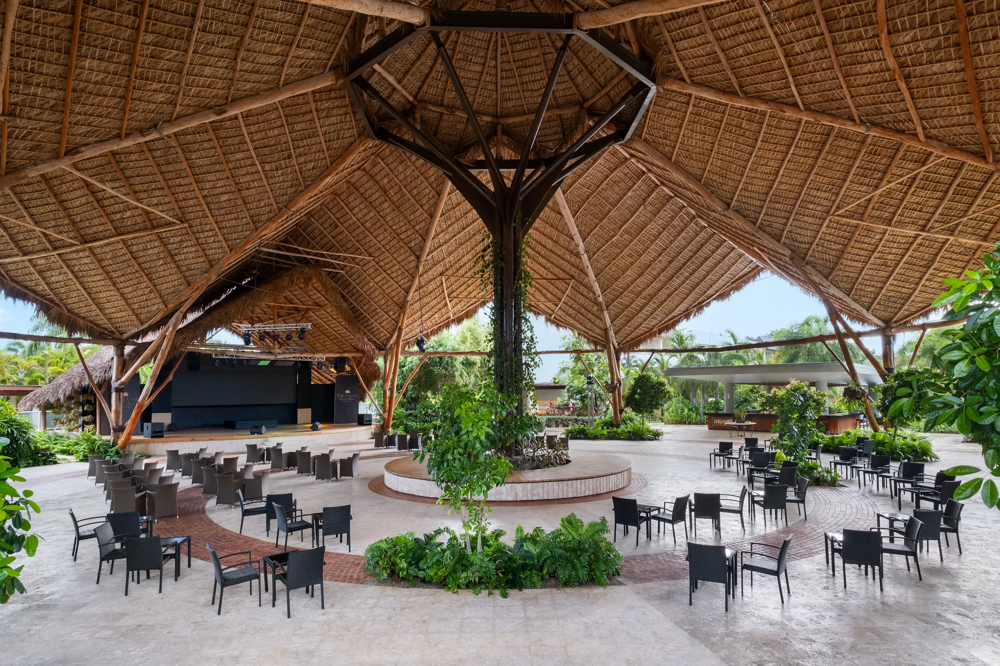 Open-air palapa theater with seating and stage at Dreams Royal Beach Punta Cana.