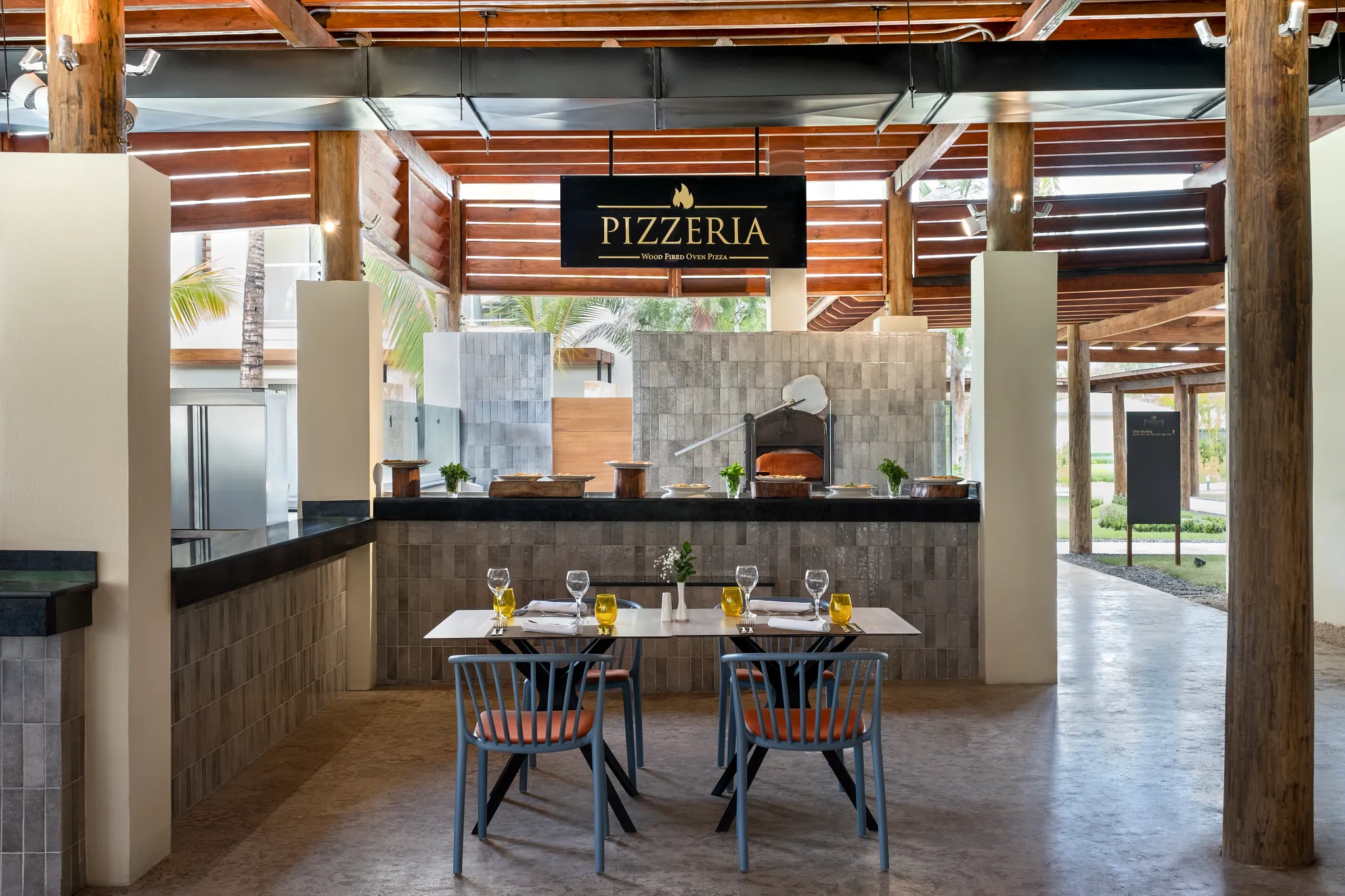 Pizzeria at Dreams Royal Beach Punta Cana featuring casual outdoor dining with freshly made pizza and grilled favorites.
