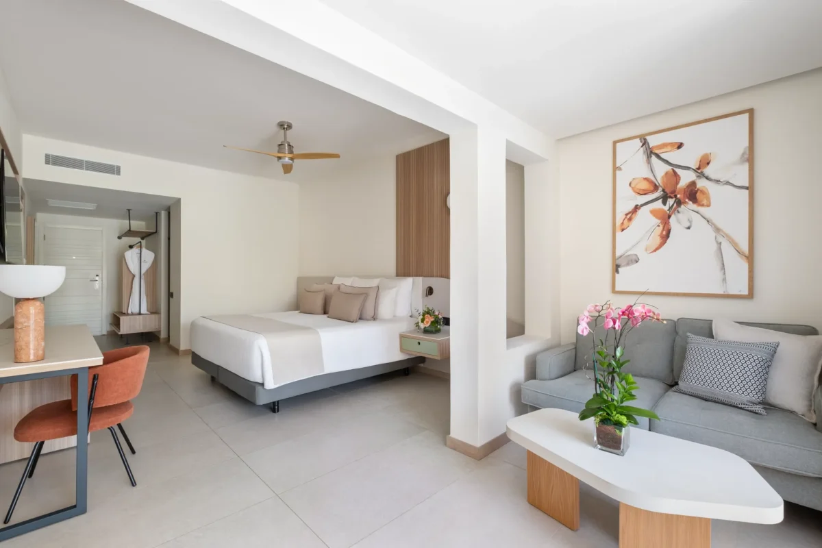 Spacious junior suite with king bed, sitting area, and modern décor.