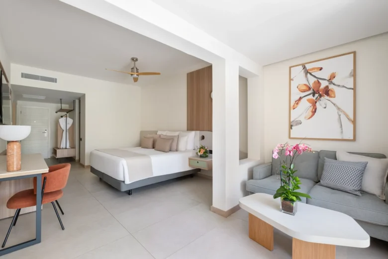 Spacious junior suite with king bed, sitting area, and modern décor.