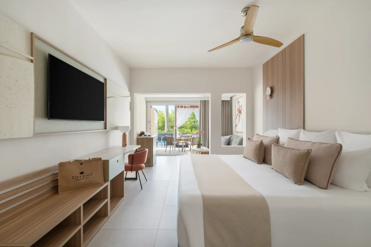 Preferred Club Junior Suite Swim Out king bedroom with terrace access at Dreams Royal Beach Punta Cana.