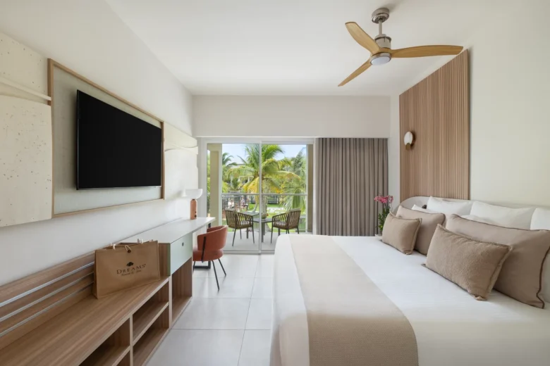 Preferred Club Premium Suite Garden View bedroom with king bed and private balcony at Dreams Royal Beach Punta Cana.