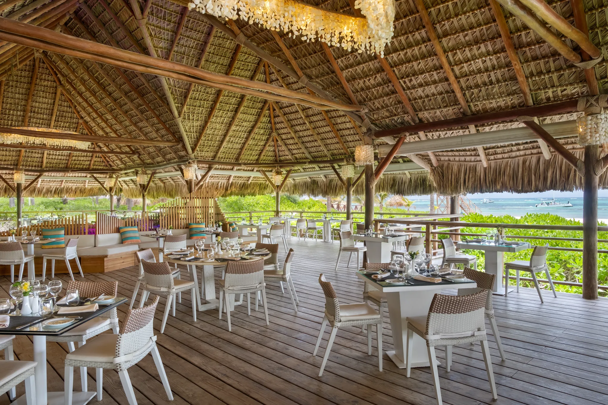 Seaside Grill at Dreams Royal Beach Punta Cana featuring beachfront dining with grilled specialties and ocean views in an elegant open-air setting.